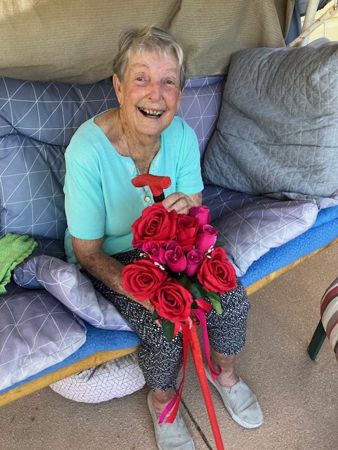 Val with her Valentine's Day themed walking stick. Image supplied. 