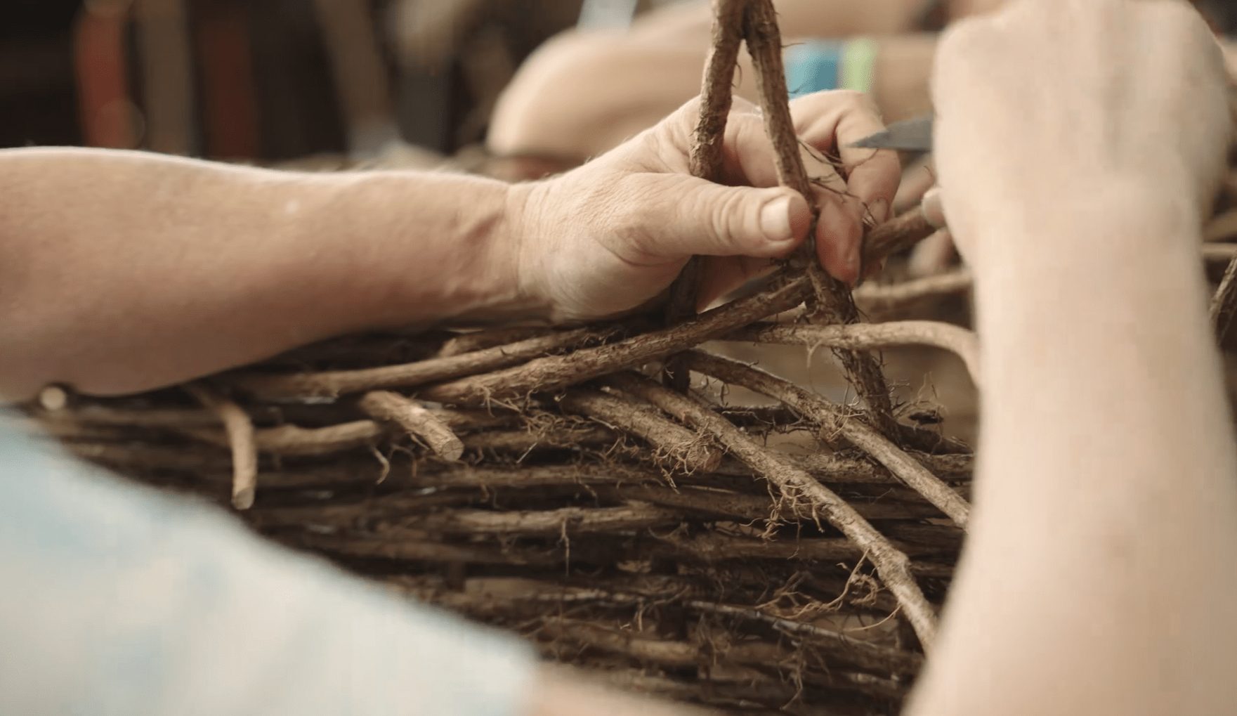 The process of weaving a coffin. Image via d'Vine Creations website.